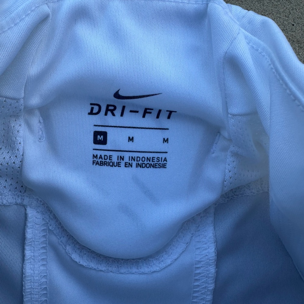 Nike dri-fit authentic size medium football pants with pads and belt.